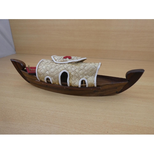 162 - A handmade wooden boat.