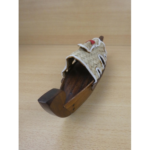 162 - A handmade wooden boat.