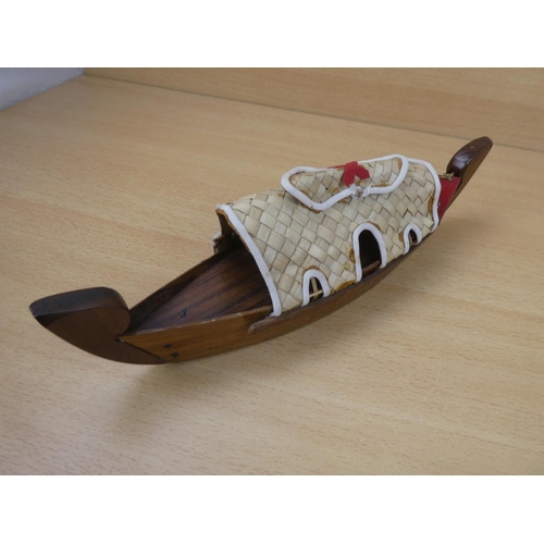 162 - A handmade wooden boat.