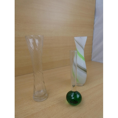 163 - A vintage green based bud vase and two others.