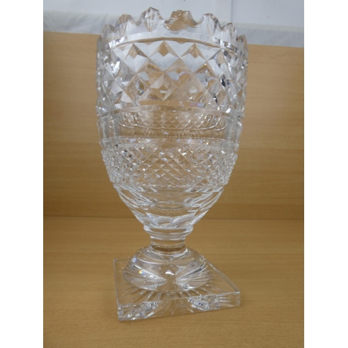 194 - A stunning large and heavy Waterford Crystal vase (small chip), measuring 26cm in height.