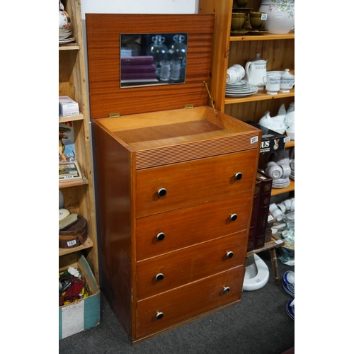 207 - A vintage chest of four drawers with lift up dressing table mirror, measuring 60x95x43cm.