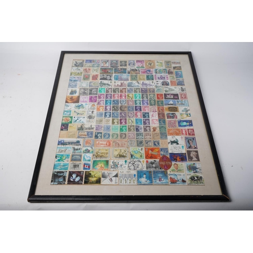 209 - A framed display of used postage stamps, measuring 42x53cm.