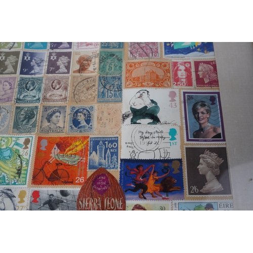 209 - A framed display of used postage stamps, measuring 42x53cm.