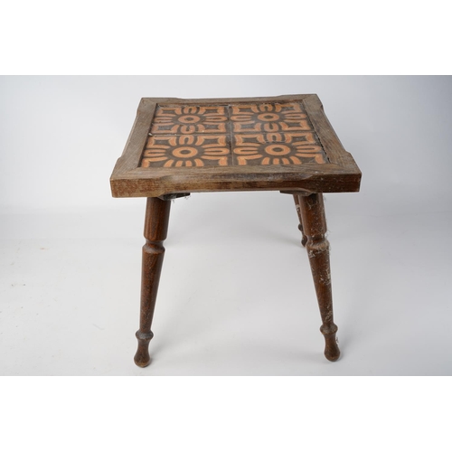 211 - A small vintage tiled top table.