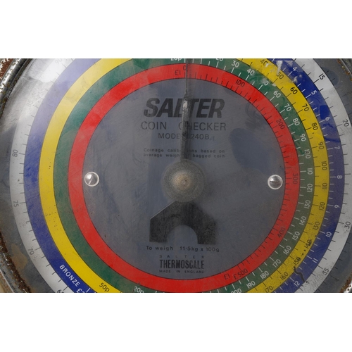 242 - A vintage set of Salter Coin Checker scales.