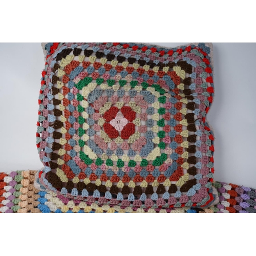 256 - A vintage handknit blanket (a/f) and matching cushion.