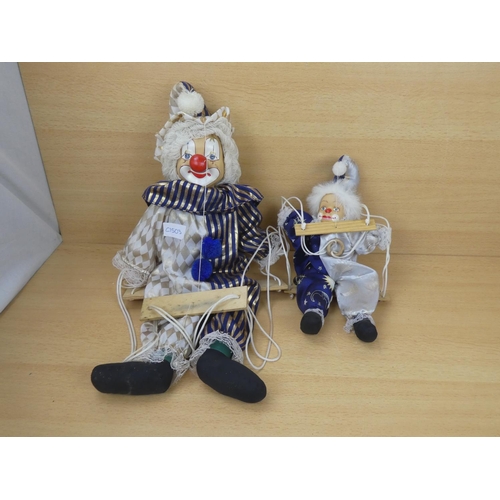 308 - Two porcelain faced clowns.