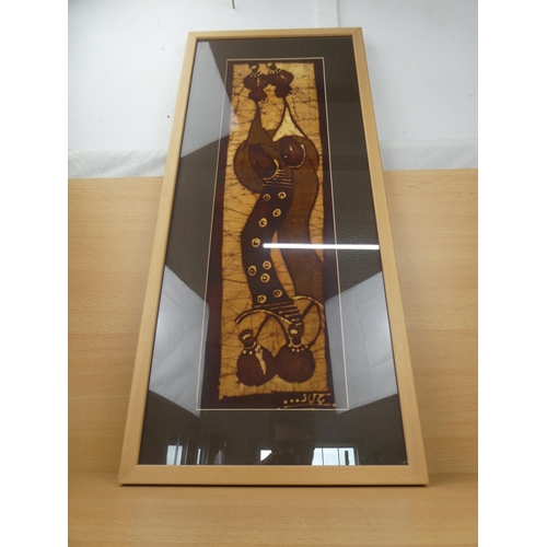 316 - A framed fabric panel of African figures, measuring 39x90cm.