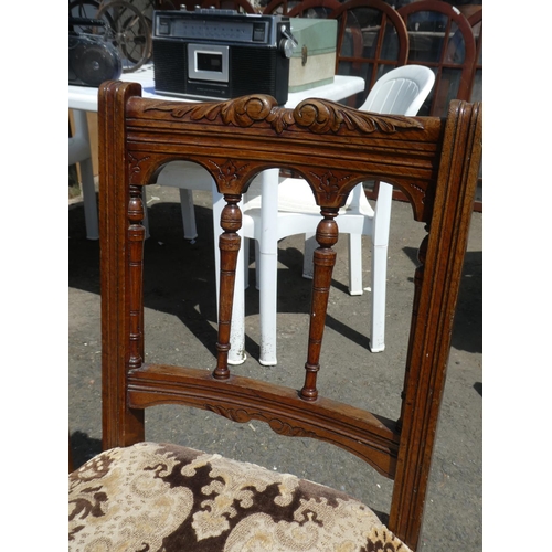 323 - A stunning set of four antique oak upholstered chairs on casters.