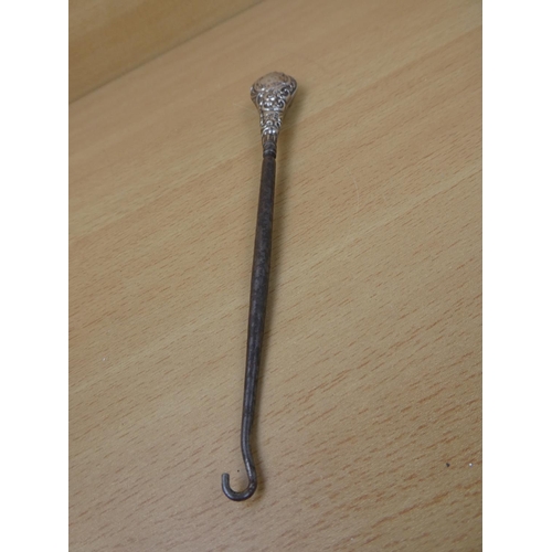 376 - A stunning Sterling Silver handled button hook.