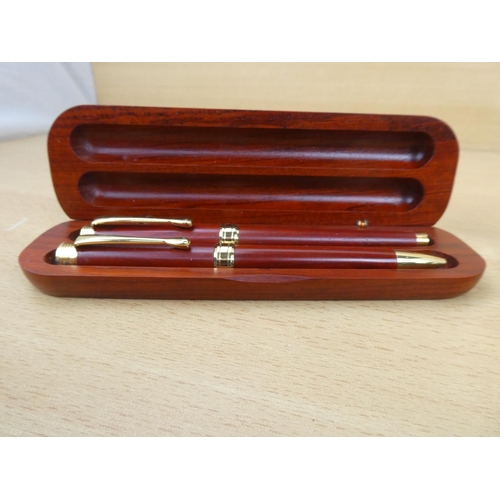 395 - Two wooden cased set of collectors pens.