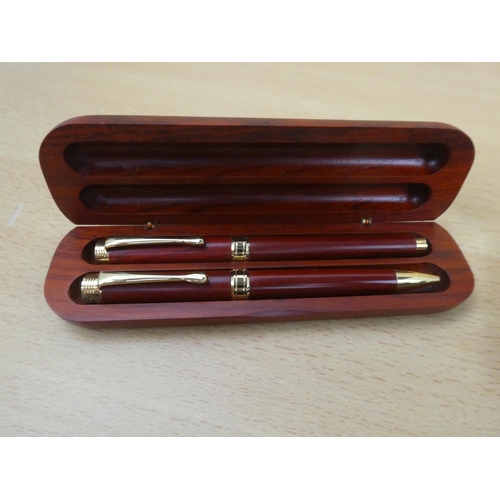 395 - Two wooden cased set of collectors pens.