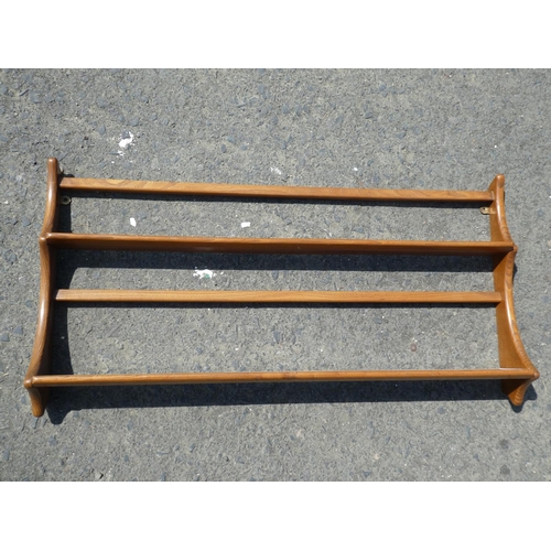 407 - A vintage Ercol teak plate rack, measuring 96x50cm.