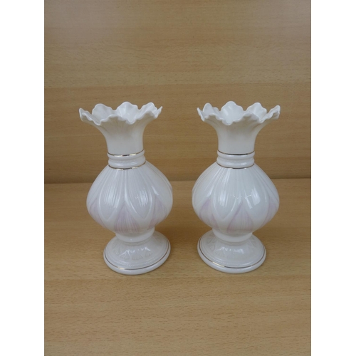 420 - A pair of Belleek pottery vases.