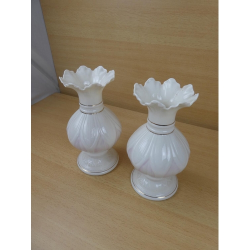 420 - A pair of Belleek pottery vases.