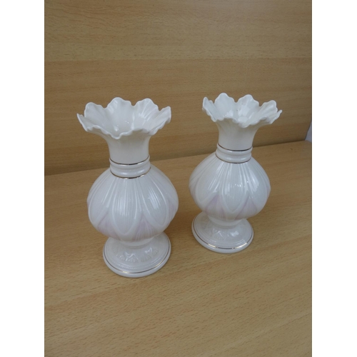 420 - A pair of Belleek pottery vases.