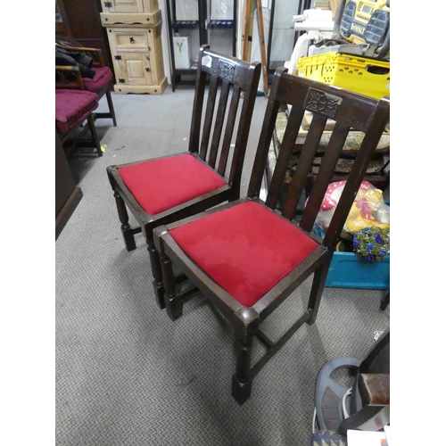 449 - A pair of oak framed chairs.