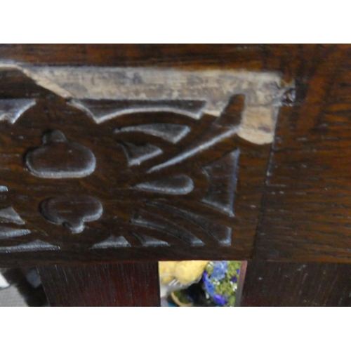 449 - A pair of oak framed chairs.