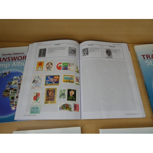 533 - Five Stanley Gibbons 'Transworld Stamp Albums' and contents.