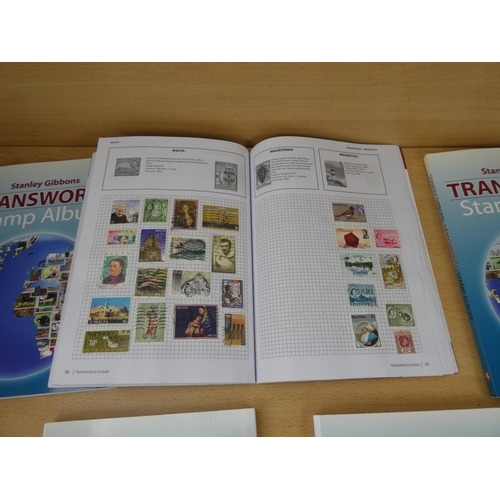 533 - Five Stanley Gibbons 'Transworld Stamp Albums' and contents.