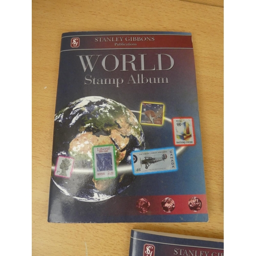 543 - A set of five Stanley Gibbons 'World' stamp albums and contents.