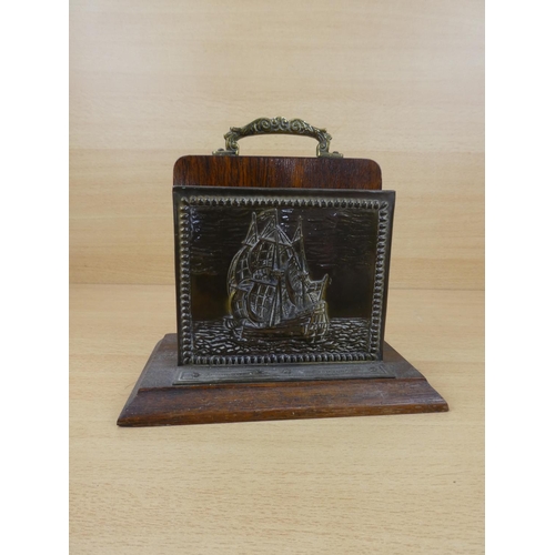 553 - A vintage brass letter holder with ship design.