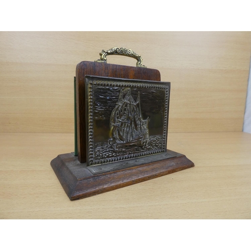 553 - A vintage brass letter holder with ship design.