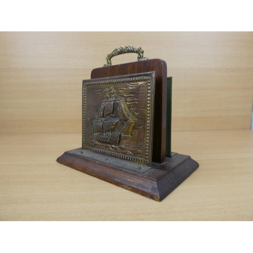 553 - A vintage brass letter holder with ship design.