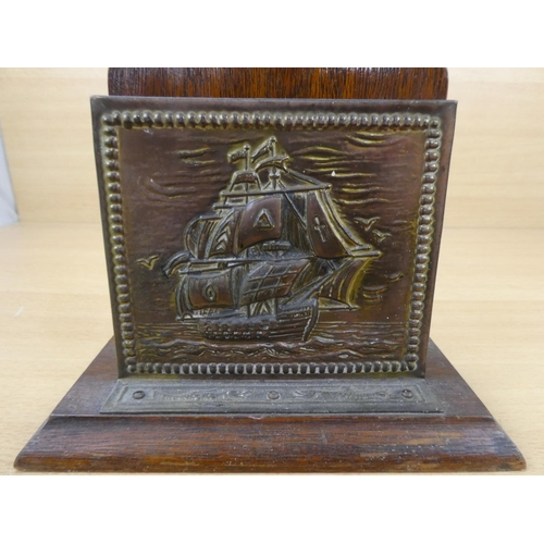 553 - A vintage brass letter holder with ship design.