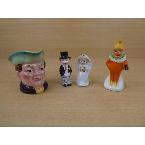 566 - A novelty ceramic salt and pepper, a Beswick mask jug 'Mr Varden' and another.