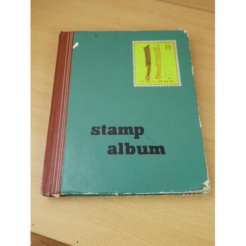 573 - A vintage stamp album & contents.