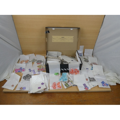 577 - A large lot of Great Britain postage stamp in individual packets.