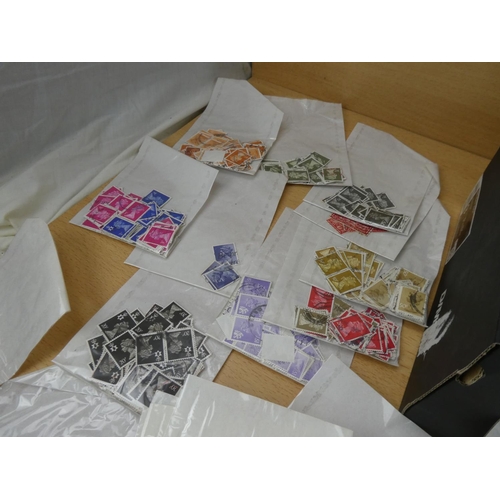 577 - A large lot of Great Britain postage stamp in individual packets.