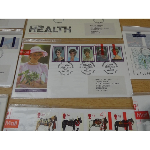 593 - Ten packs of Royal Mail first day covers.