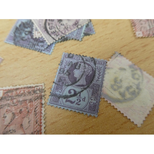 597 - A collection of used postage stamps.