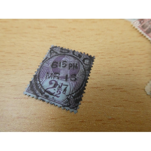 597 - A collection of used postage stamps.