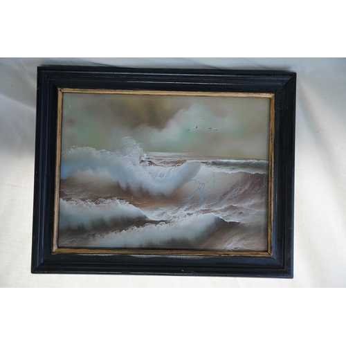 611 - A framed oil painting of rough seas signed, measuring 39x49cm.