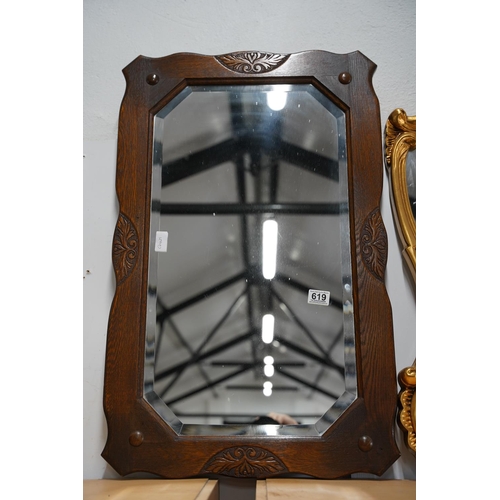 619 - A vintage oak framed wall mirror, measuring 52x80cm.