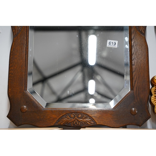 619 - A vintage oak framed wall mirror, measuring 52x80cm.