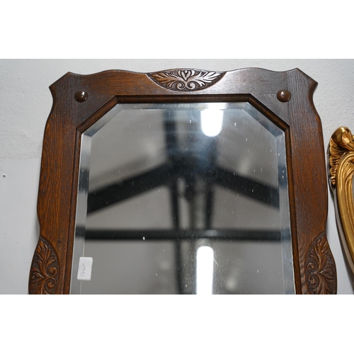 619 - A vintage oak framed wall mirror, measuring 52x80cm.