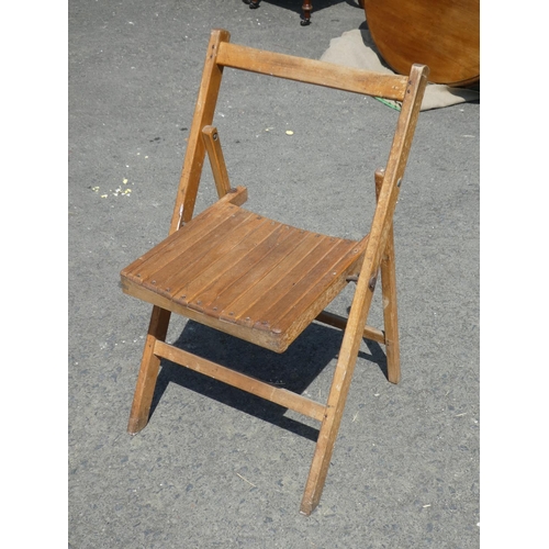 637 - A wooden folding garden chair.