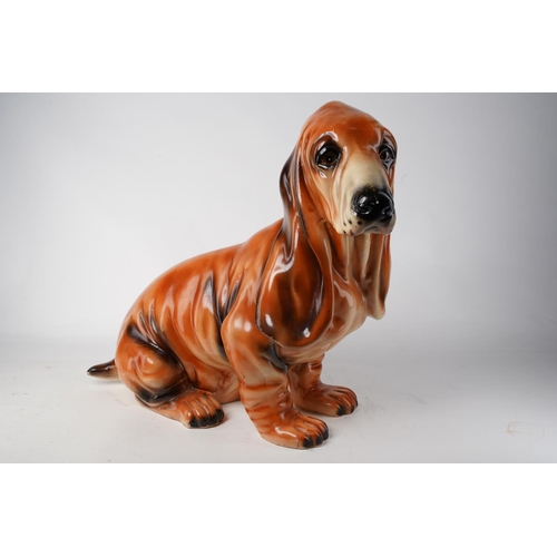 656 - A large ceramic Basset Hound/ dog, measuring 44cm in height. (a/f)