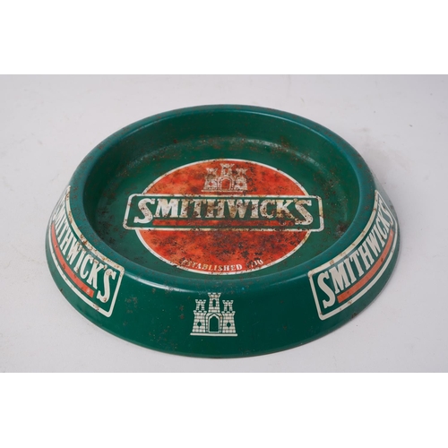 677 - A Smithwicks metal ashtray.