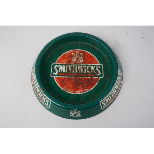 677 - A Smithwicks metal ashtray.