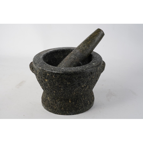 713 - A stunning large granite pestle and mortar.