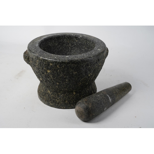 713 - A stunning large granite pestle and mortar.