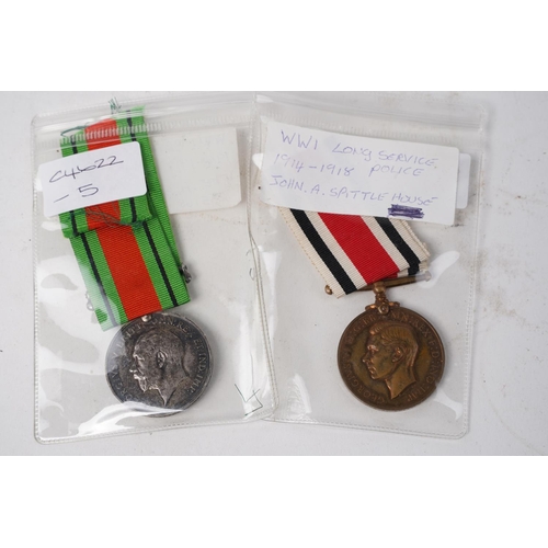 762 - A stunning WW1 Long Service Police medal 1914 - 1918 for John A Spittlehouse and a WW1 British War m... 