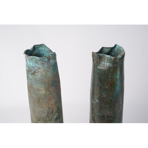 781 - Two antique copper shell cases.