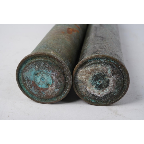 781 - Two antique copper shell cases.